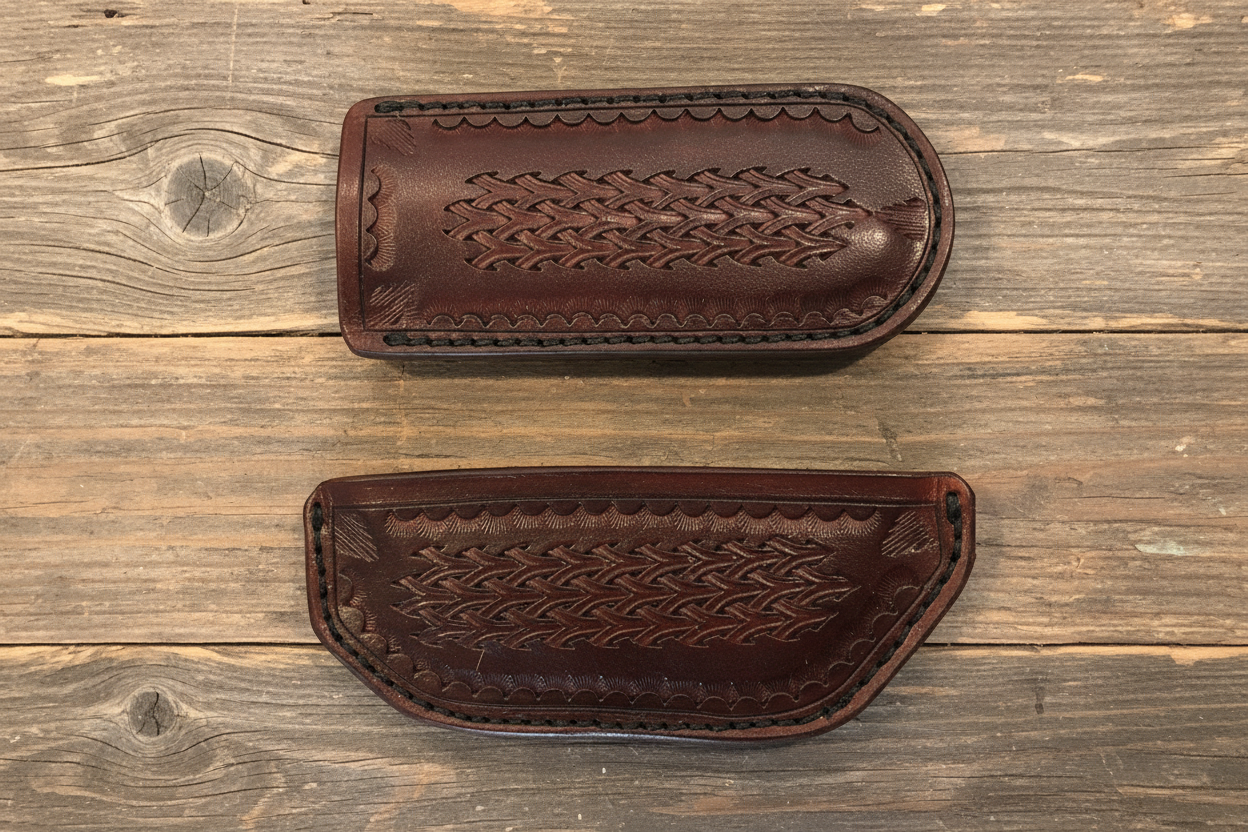 Two brown leather cases with intricate patterns on a wooden surface