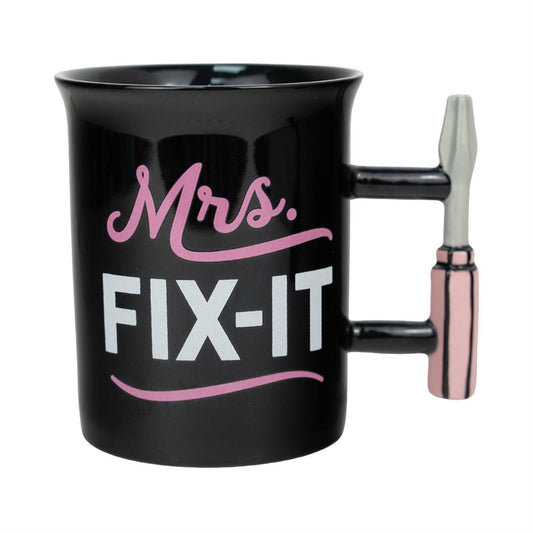 Black mug with 'Mrs. Fix-It' text and tool handle on a white background