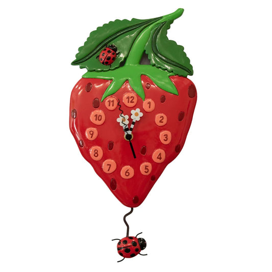Strawberry-shaped clock with ladybug design on a white background