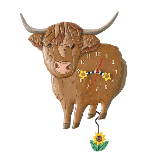 Wooden appearing clock shaped like a highland cow on a white background