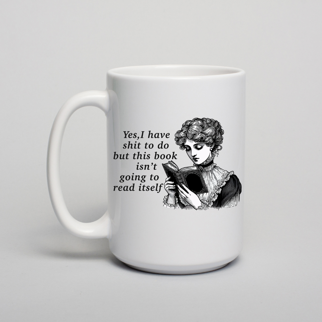 White mug with black text and illustration of a woman reading a book on a light gray background