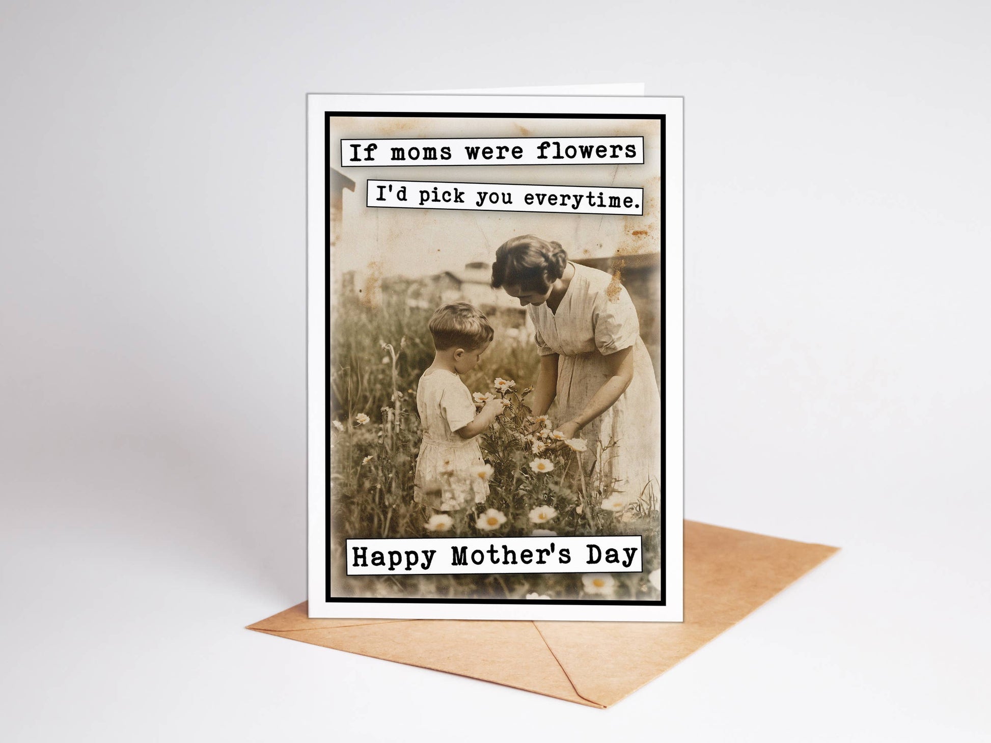 Mother's Day card with vintage photo of a woman and child in a garden, text overlay.